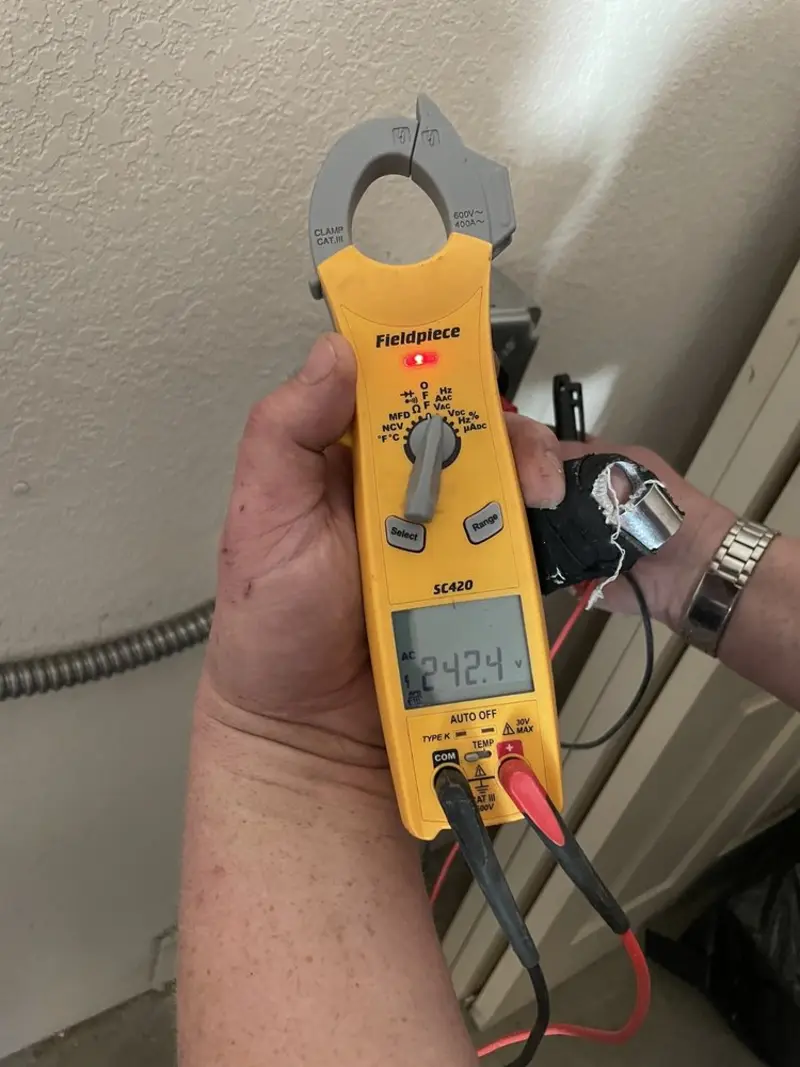 Voltage testing with clamp meter during Circuit Breaker Repair in China Grove